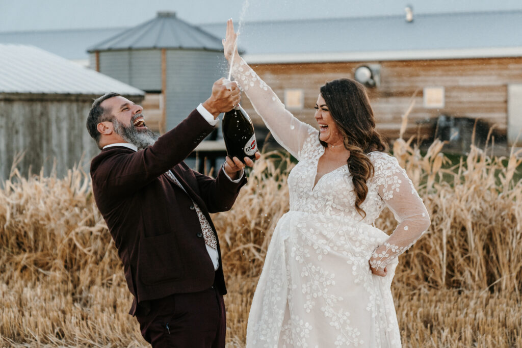 newlyweds popping Champagne 